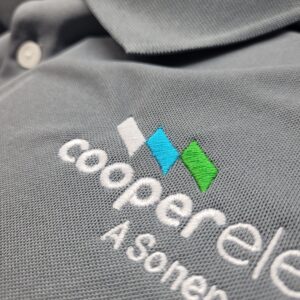 Cooperele Embroidered on a Grey Fabric