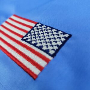 American Flag Embroidered on a Sky Blue Fabric.